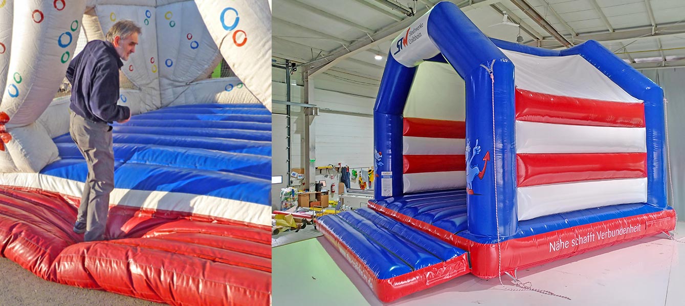 Eine Hüpfburg wird von  einem Mann begutachtet.