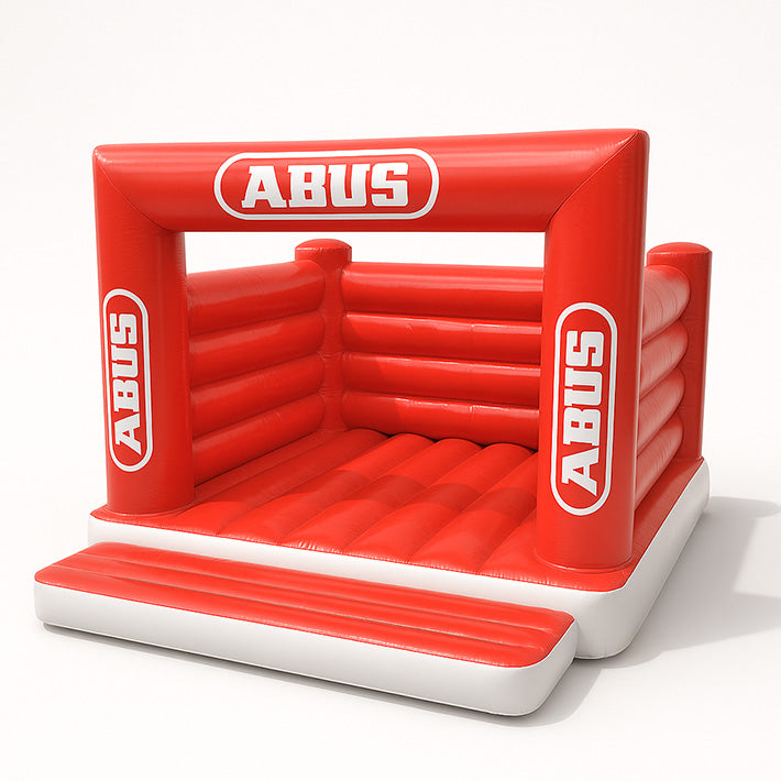 Individuelle Hüpfburg in rot und weiß für und von der Firma "Abus".