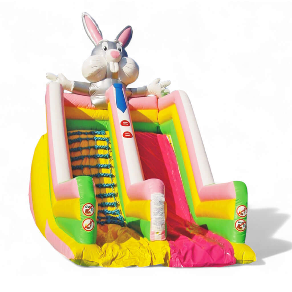 Hüpfburg Riesenrutsche Hase mit pinker Rutschfläche, buntem Aufstieg und großer Hasenfigur – farbenfrohes Eventmodul für Kinder