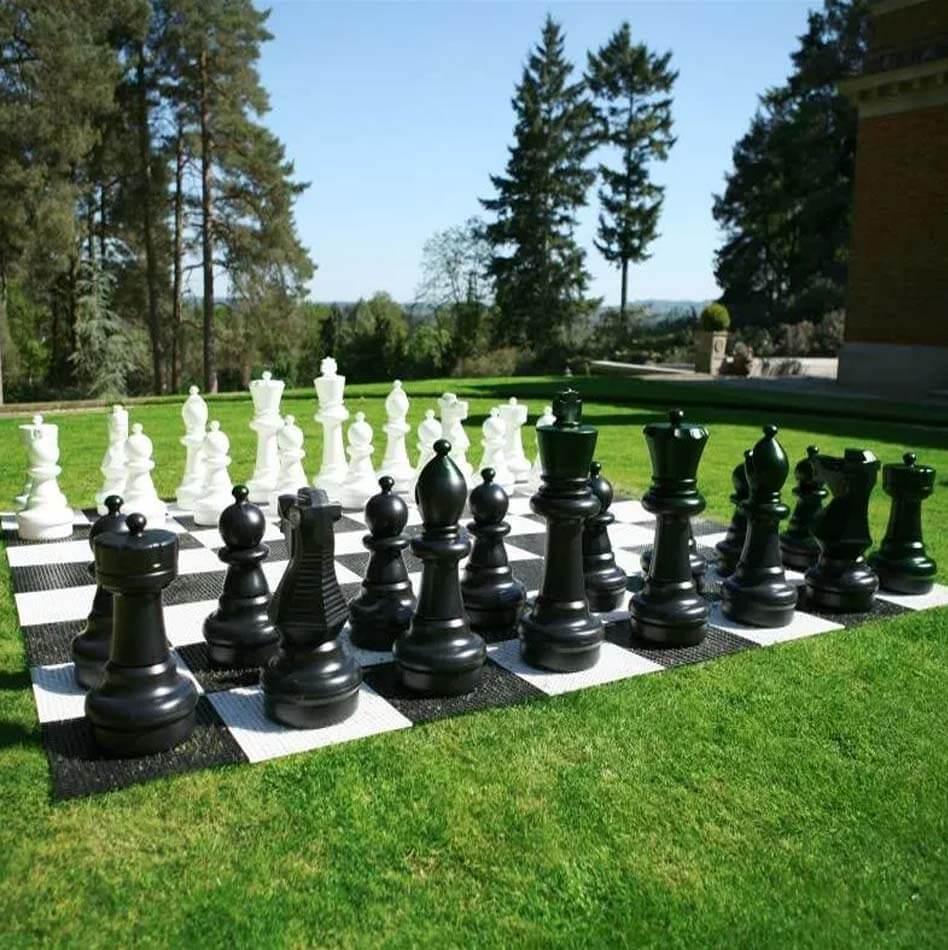 XXL chess with large pieces on an outdoor lawn