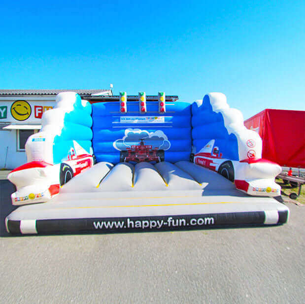 Bouncy castle from the front without a roof and an open entrance with three traffic lights on the back wall in Formula 1 style