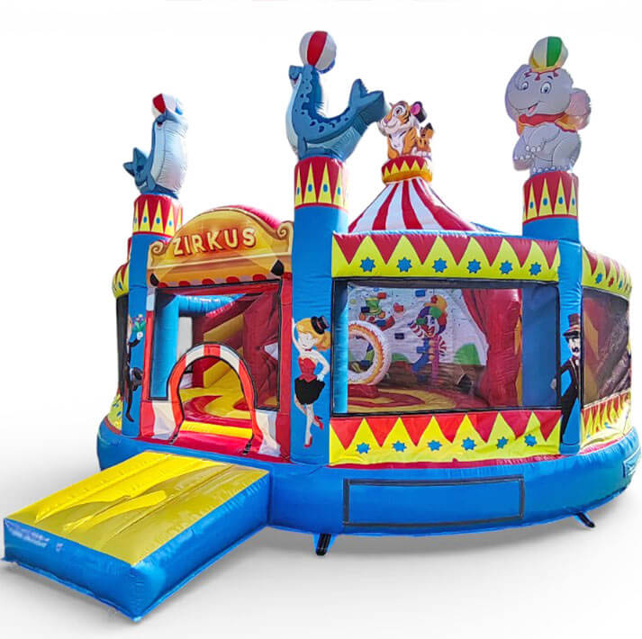 Aufblasbare Zirkus-Hüpfburg mit Rutsche und bunten Tierfiguren