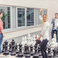 XXL chess with large pieces and players outside