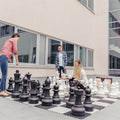 XXL chess with large pieces and players outside
